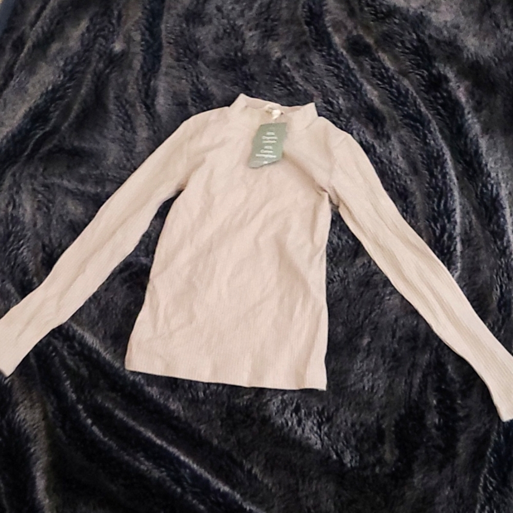 Beige turtleneck NEVER WORN!! And yes I do not remember the price I'm very sorry